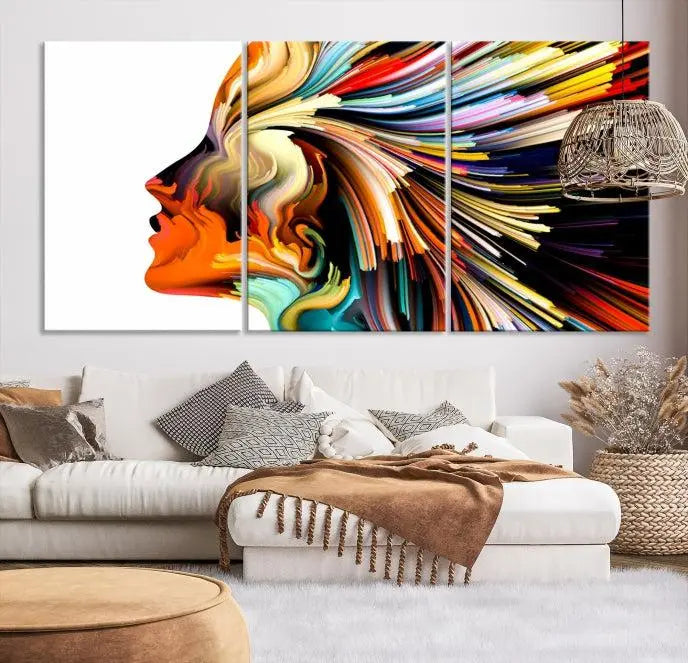 The "Profile Colors Canvas Print," featuring a colorful abstract face on museum-quality canvas, graces the wall.