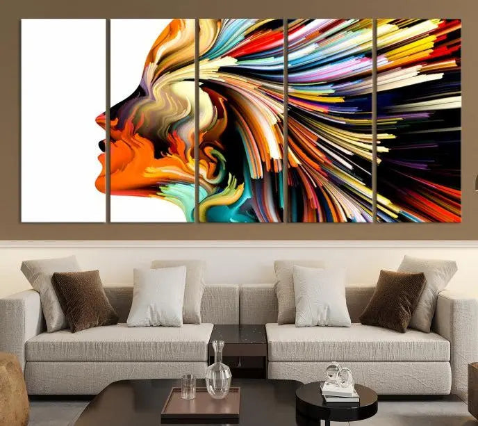 The "Profile Colors Canvas Print," featuring a colorful abstract face on museum-quality canvas, graces the wall.