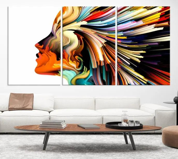 The "Profile Colors Canvas Print," featuring a colorful abstract face on museum-quality canvas, graces the wall.