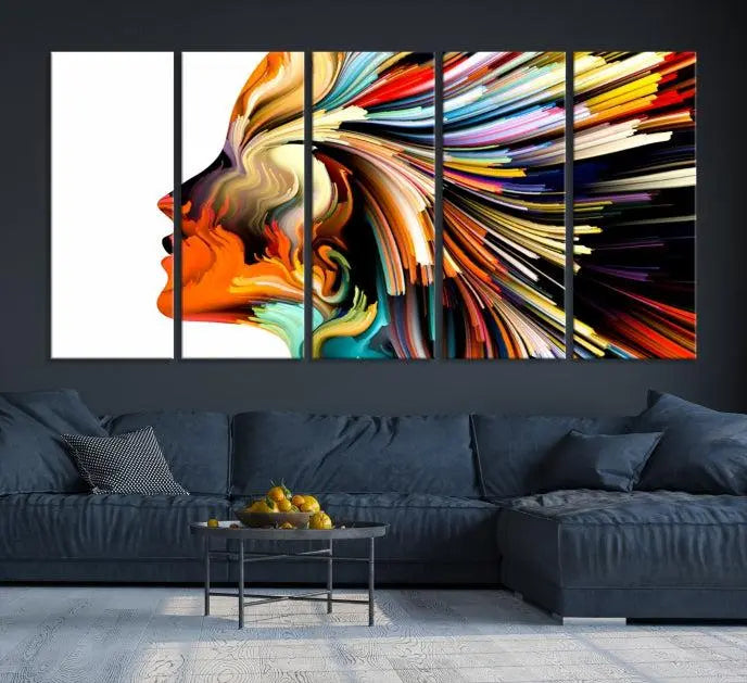 The "Profile Colors Canvas Print," featuring a colorful abstract face on museum-quality canvas, graces the wall.