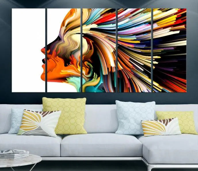 The "Profile Colors Canvas Print," featuring a colorful abstract face on museum-quality canvas, graces the wall.