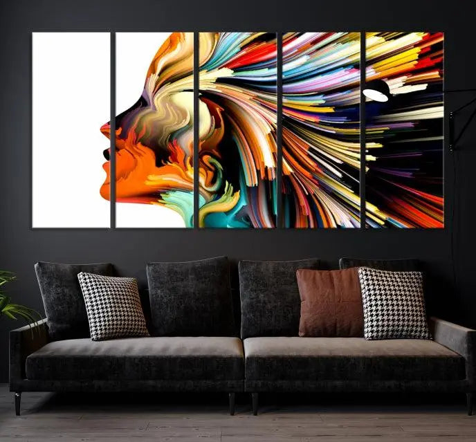 The "Profile Colors Canvas Print," featuring a colorful abstract face on museum-quality canvas, graces the wall.