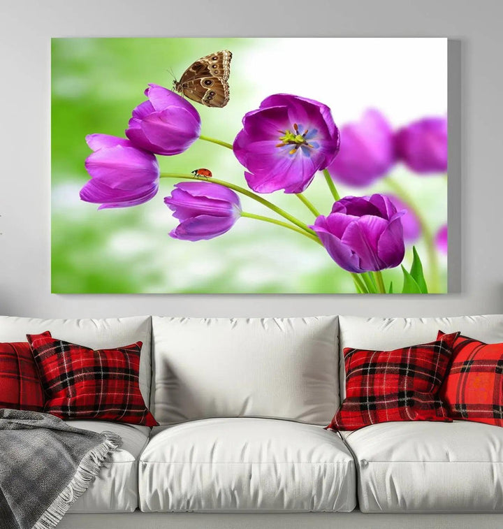 The Purple Tulips, Butterfly and Ladybug Wall Art Floral Canvas Print is a museum-quality piece elegantly displayed. Ready to hang, this artwork beautifully showcases a butterfly and ladybug amidst purple tulips.