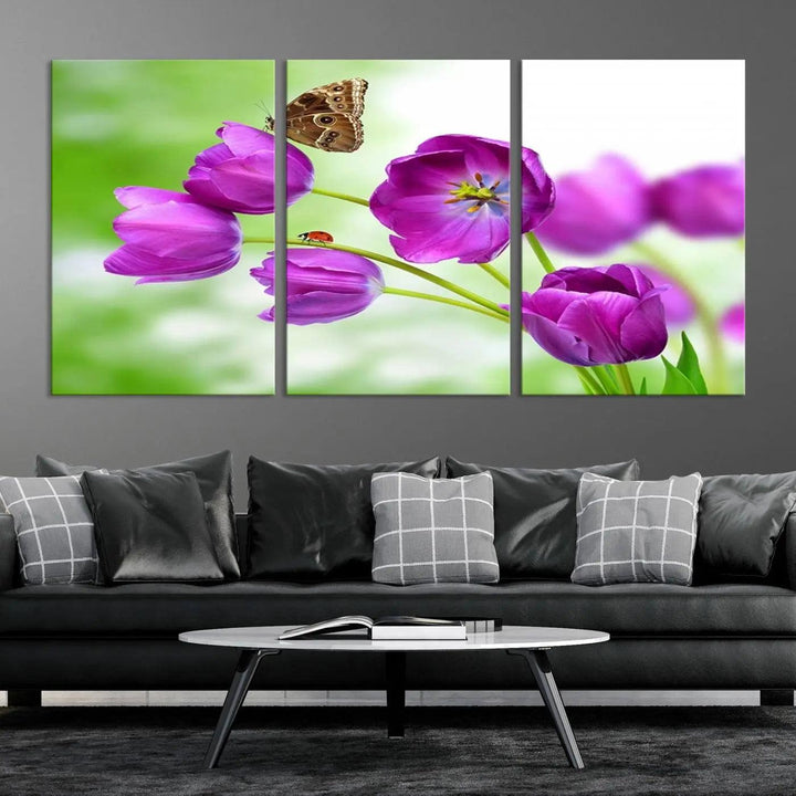 The Purple Tulips, Butterfly and Ladybug Wall Art Floral Canvas Print is a museum-quality piece elegantly displayed. Ready to hang, this artwork beautifully showcases a butterfly and ladybug amidst purple tulips.