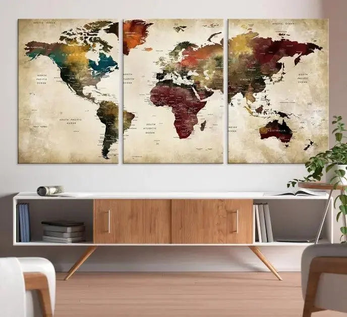 A Push Pin Watercolor World Map on a grunge background, printed on museum-quality canvases and gallery wrapped for a polished finish, hangs prominently on the wall.