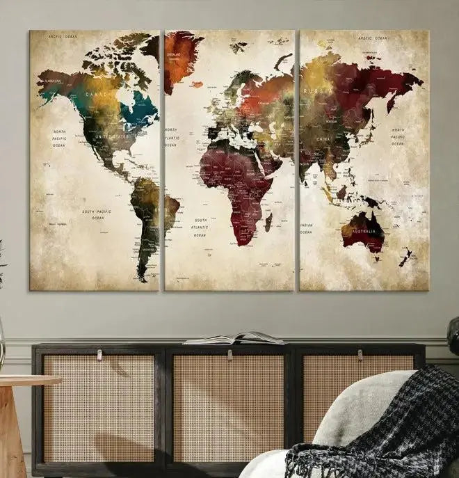 A Push Pin Watercolor World Map on a grunge background, printed on museum-quality canvases and gallery wrapped for a polished finish, hangs prominently on the wall.