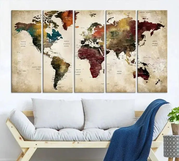 A Push Pin Watercolor World Map on a grunge background, printed on museum-quality canvases and gallery wrapped for a polished finish, hangs prominently on the wall.