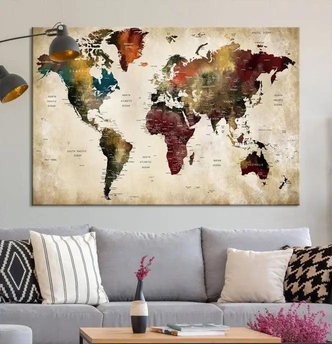 A Push Pin Watercolor World Map on a grunge background, printed on museum-quality canvases and gallery wrapped for a polished finish, hangs prominently on the wall.