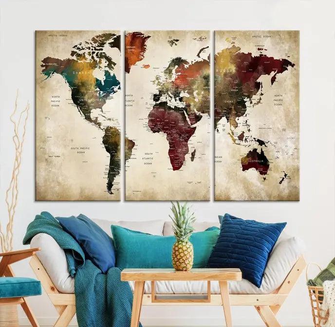 A Push Pin Watercolor World Map on a grunge background, printed on museum-quality canvases and gallery wrapped for a polished finish, hangs prominently on the wall.