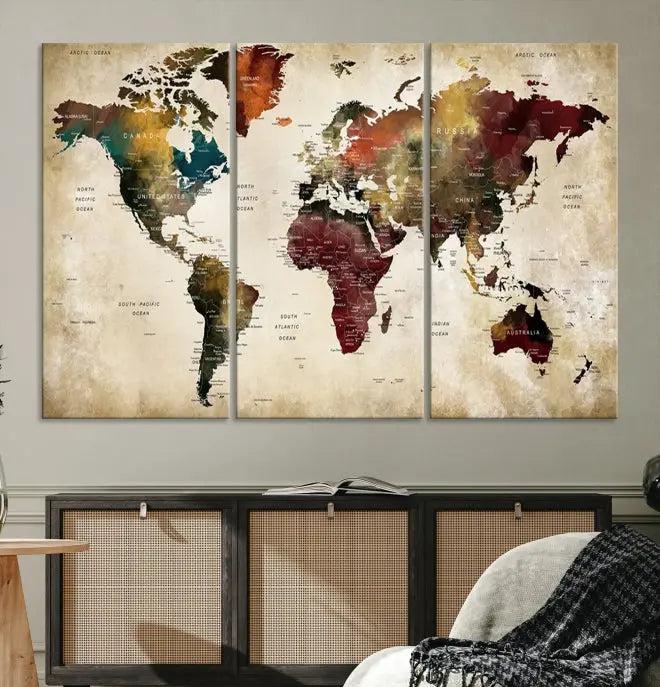 A Push Pin Watercolor World Map on a grunge background, printed on museum-quality canvases and gallery wrapped for a polished finish, hangs prominently on the wall.