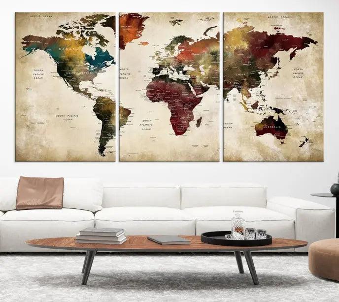 A Push Pin Watercolor World Map on a grunge background, printed on museum-quality canvases and gallery wrapped for a polished finish, hangs prominently on the wall.