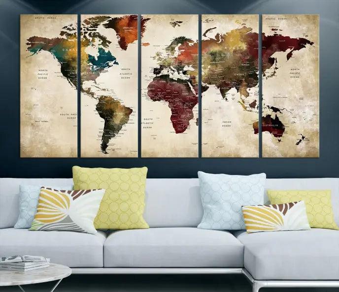 A Push Pin Watercolor World Map on a grunge background, printed on museum-quality canvases and gallery wrapped for a polished finish, hangs prominently on the wall.