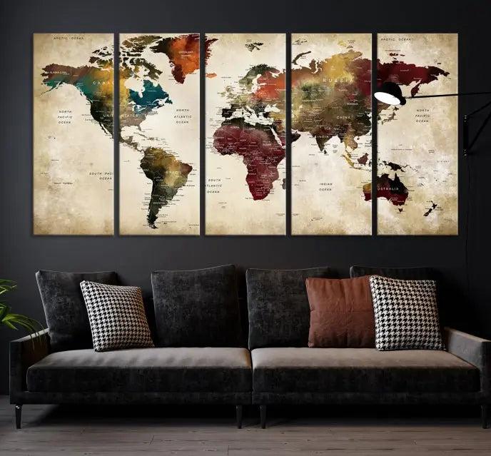 A Push Pin Watercolor World Map on a grunge background, printed on museum-quality canvases and gallery wrapped for a polished finish, hangs prominently on the wall.