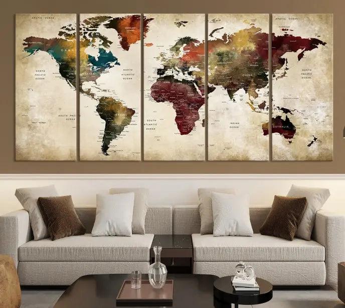 A Push Pin Watercolor World Map on a grunge background, printed on museum-quality canvases and gallery wrapped for a polished finish, hangs prominently on the wall.