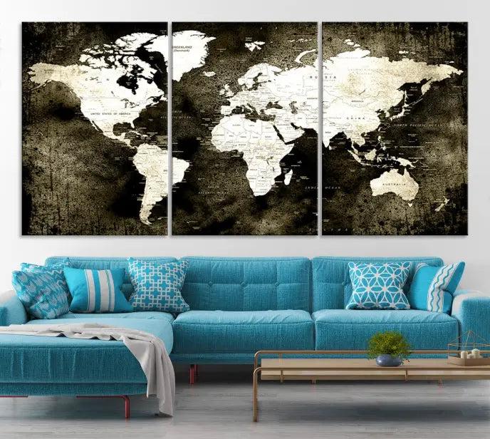 A gallery-wrapped, three-panel Push Pin World Map Canvas Print, crafted on museum-quality canvas, adorns the wall.