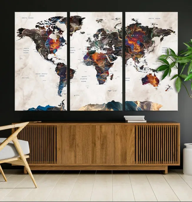 The Push Pin World Map Canvas Wall Art Print, crafted on museum-quality canvas with colorful regions, comes ready to hang and features a UV-protective coating to preserve its vibrant colors.