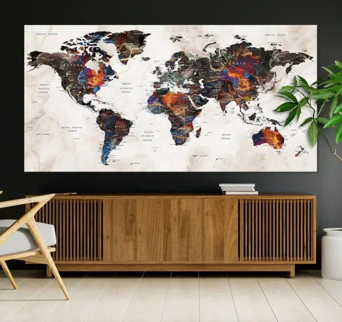 The "Push Pin World Map Painting Canvas Wall Art Print," a vibrant five-panel artwork with a gallery wrap and UV-protective coating, is displayed against a dark wall.