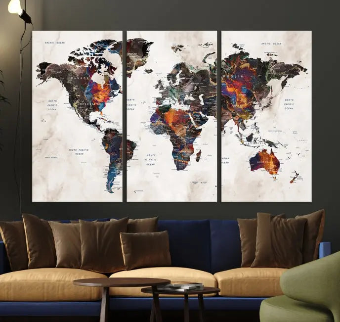 The "Push Pin World Map Painting Canvas Wall Art Print," a vibrant five-panel artwork with a gallery wrap and UV-protective coating, is displayed against a dark wall.