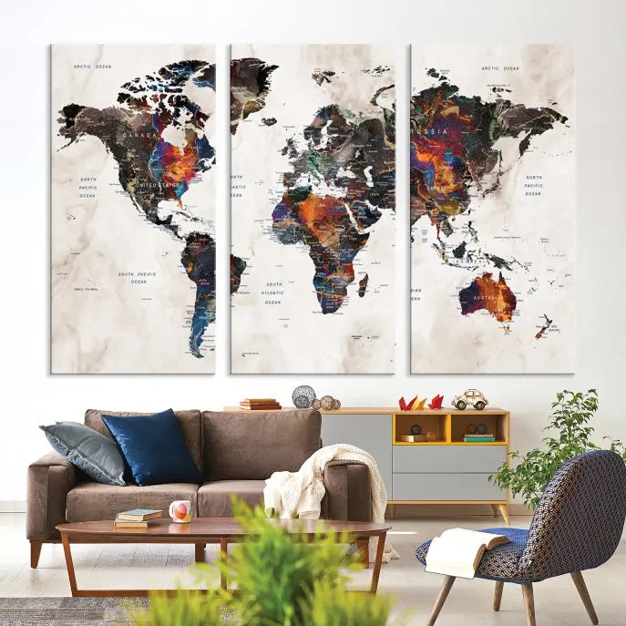 The "Push Pin World Map Painting Canvas Wall Art Print," a vibrant five-panel artwork with a gallery wrap and UV-protective coating, is displayed against a dark wall.