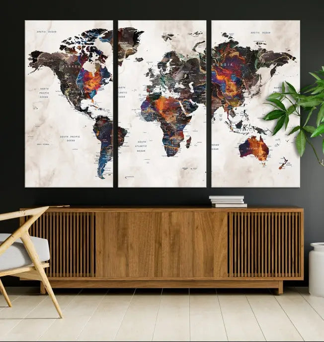 The "Push Pin World Map Painting Canvas Wall Art Print," a vibrant five-panel artwork with a gallery wrap and UV-protective coating, is displayed against a dark wall.