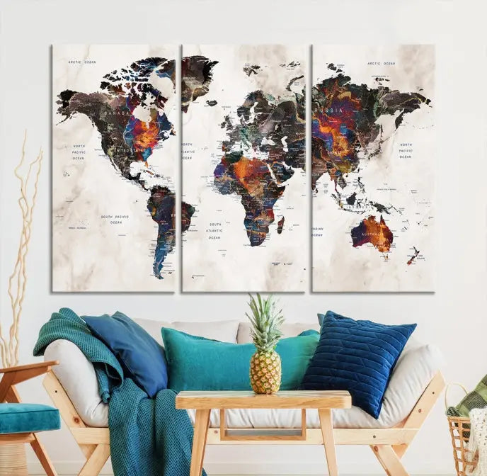 The "Push Pin World Map Painting Canvas Wall Art Print," a vibrant five-panel artwork with a gallery wrap and UV-protective coating, is displayed against a dark wall.