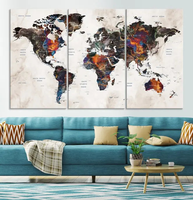 The "Push Pin World Map Painting Canvas Wall Art Print," a vibrant five-panel artwork with a gallery wrap and UV-protective coating, is displayed against a dark wall.