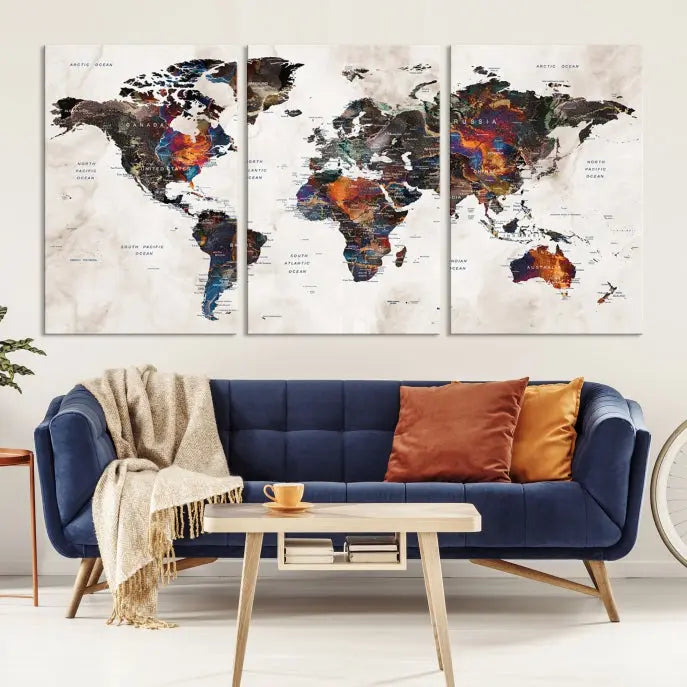 The "Push Pin World Map Painting Canvas Wall Art Print," a vibrant five-panel artwork with a gallery wrap and UV-protective coating, is displayed against a dark wall.