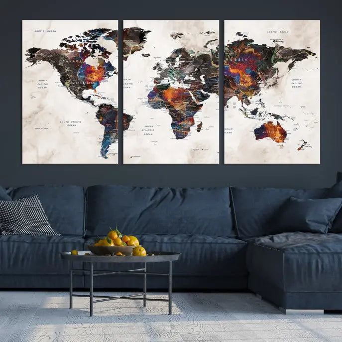 The "Push Pin World Map Painting Canvas Wall Art Print," a vibrant five-panel artwork with a gallery wrap and UV-protective coating, is displayed against a dark wall.