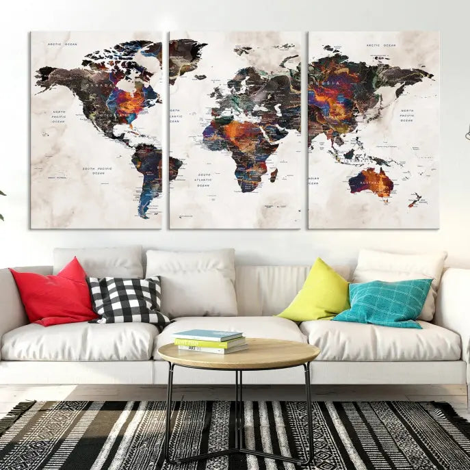 The "Push Pin World Map Painting Canvas Wall Art Print," a vibrant five-panel artwork with a gallery wrap and UV-protective coating, is displayed against a dark wall.