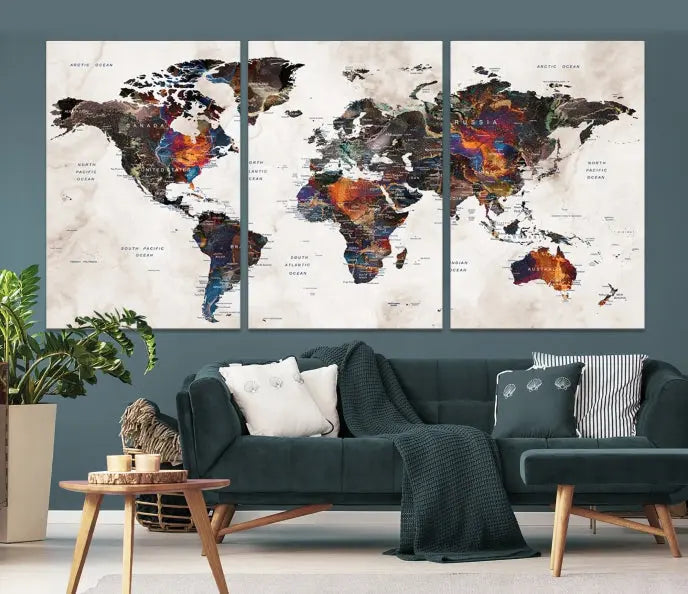 The "Push Pin World Map Painting Canvas Wall Art Print," a vibrant five-panel artwork with a gallery wrap and UV-protective coating, is displayed against a dark wall.