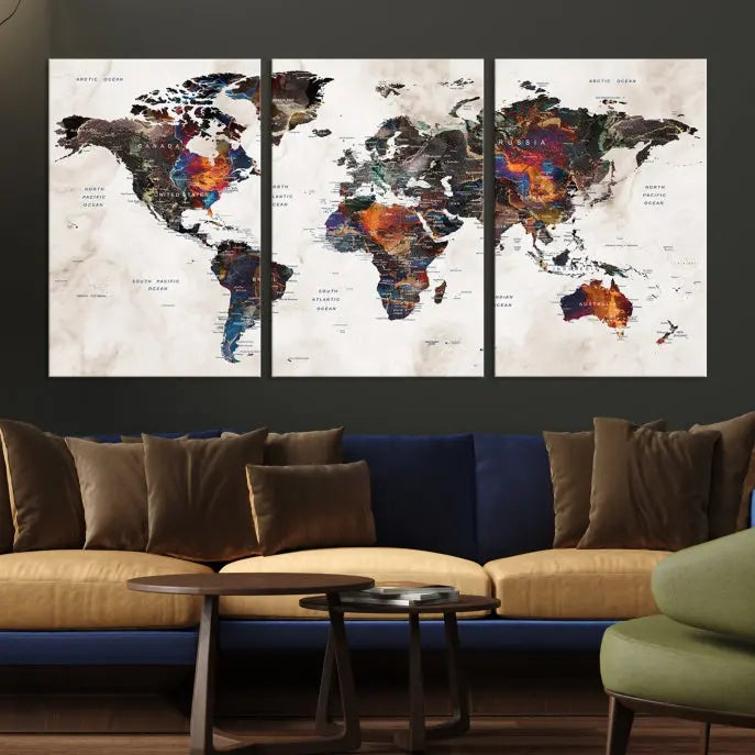 The "Push Pin World Map Painting Canvas Wall Art Print," a vibrant five-panel artwork with a gallery wrap and UV-protective coating, is displayed against a dark wall.