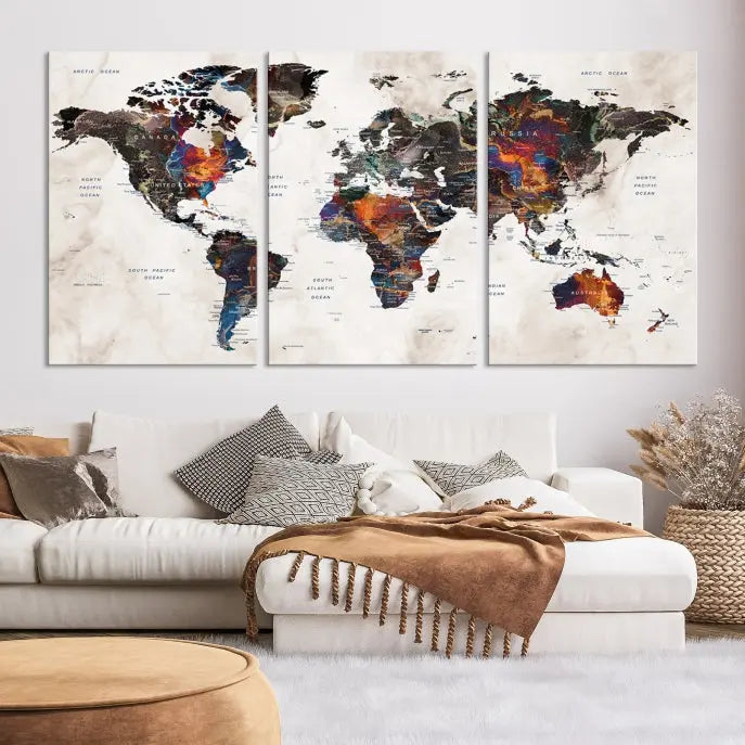 The "Push Pin World Map Painting Canvas Wall Art Print," a vibrant five-panel artwork with a gallery wrap and UV-protective coating, is displayed against a dark wall.