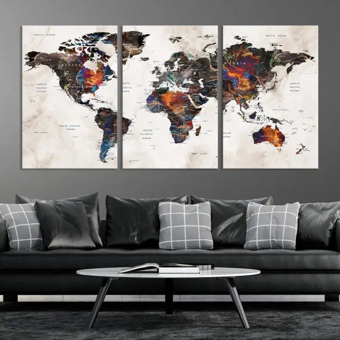 The "Push Pin World Map Painting Canvas Wall Art Print," a vibrant five-panel artwork with a gallery wrap and UV-protective coating, is displayed against a dark wall.