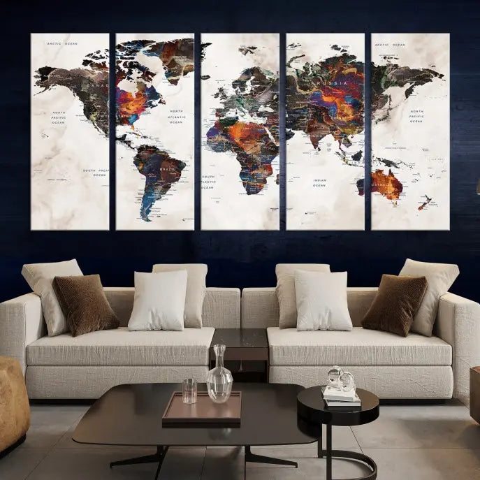 The "Push Pin World Map Painting Canvas Wall Art Print," a vibrant five-panel artwork with a gallery wrap and UV-protective coating, is displayed against a dark wall.