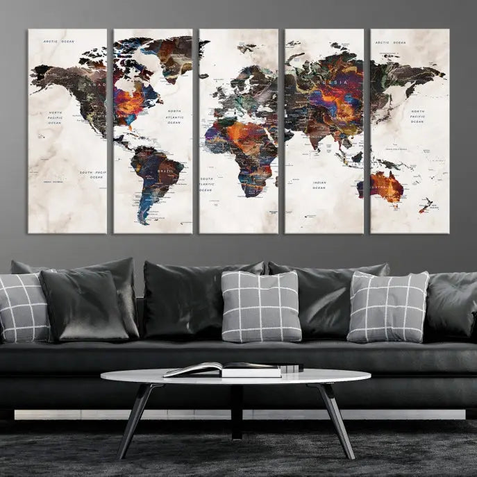 The "Push Pin World Map Painting Canvas Wall Art Print," a vibrant five-panel artwork with a gallery wrap and UV-protective coating, is displayed against a dark wall.