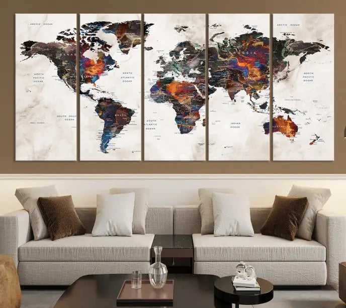 The "Push Pin World Map Painting Canvas Wall Art Print," a vibrant five-panel artwork with a gallery wrap and UV-protective coating, is displayed against a dark wall.