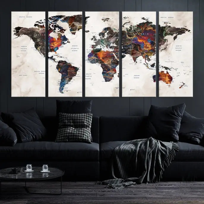 The "Push Pin World Map Painting Canvas Wall Art Print," a vibrant five-panel artwork with a gallery wrap and UV-protective coating, is displayed against a dark wall.