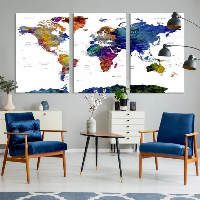 A modern living room is beautifully adorned with the Push Pin World Map Wall Art Canvas Print, a vibrant triptych of colorful world maps crafted on museum-quality canvas and perfectly gallery wrapped. This striking artwork stands out on its own, enhancing the room's overall aesthetics.