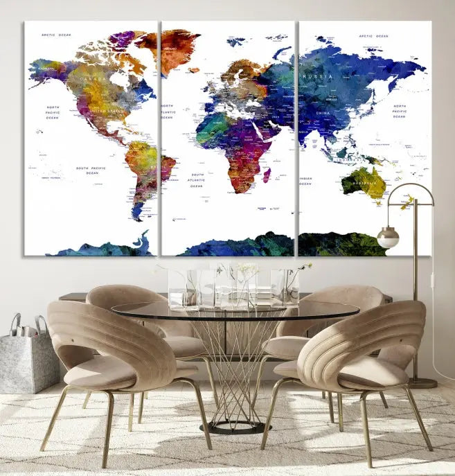 A modern living room is beautifully adorned with the Push Pin World Map Wall Art Canvas Print, a vibrant triptych of colorful world maps crafted on museum-quality canvas and perfectly gallery wrapped. This striking artwork stands out on its own, enhancing the room's overall aesthetics.