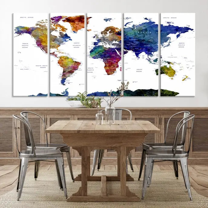 A modern living room is beautifully adorned with the Push Pin World Map Wall Art Canvas Print, a vibrant triptych of colorful world maps crafted on museum-quality canvas and perfectly gallery wrapped. This striking artwork stands out on its own, enhancing the room's overall aesthetics.