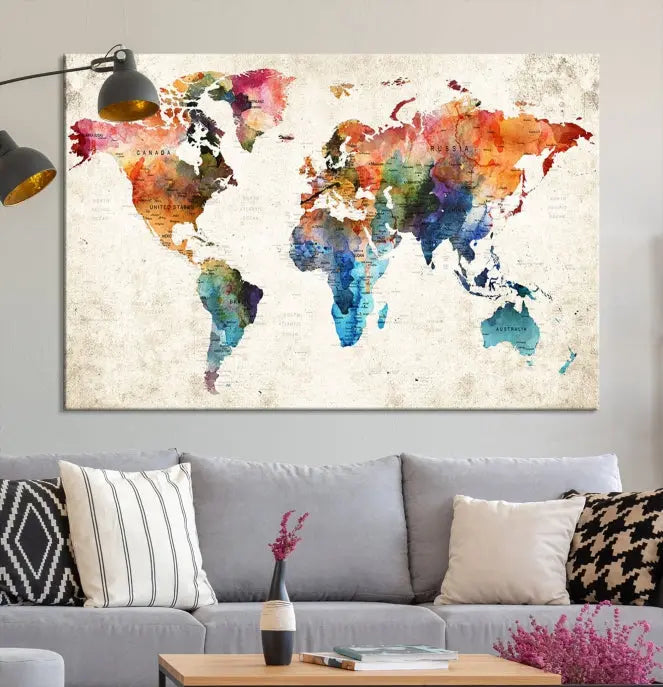 A Push Pin World Map Wall Art Canvas Print with a colorful abstract design and UV-protective coating is displayed on the wall.