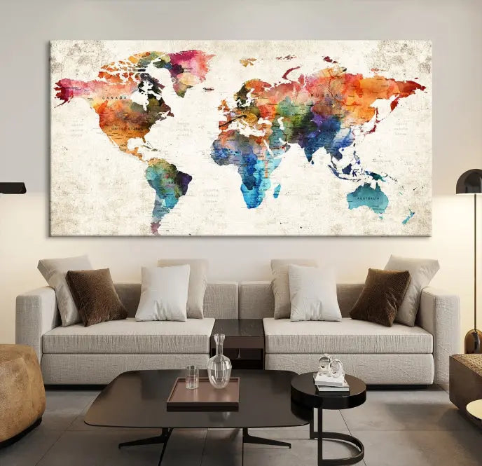 A Push Pin World Map Wall Art Canvas Print with a colorful abstract design and UV-protective coating is displayed on the wall.