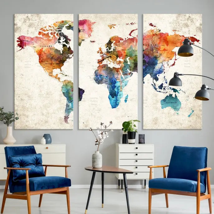 A Push Pin World Map Wall Art Canvas Print with a colorful abstract design and UV-protective coating is displayed on the wall.