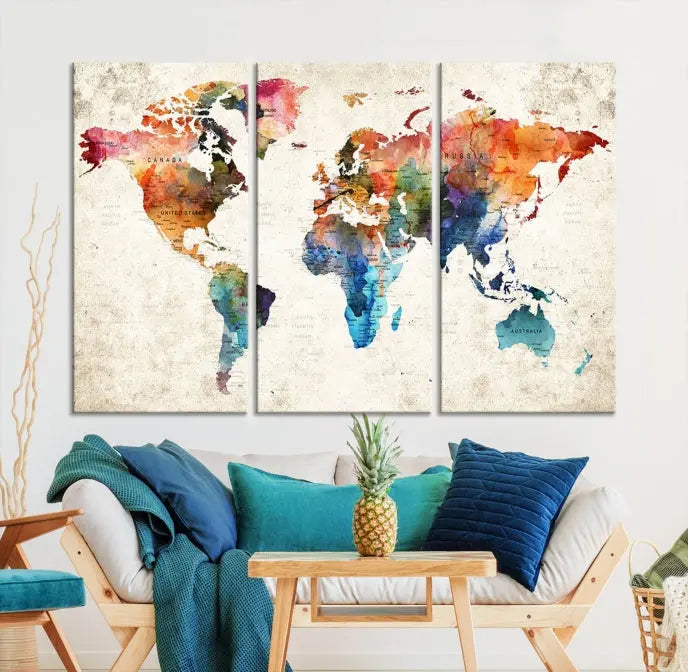 A Push Pin World Map Wall Art Canvas Print with a colorful abstract design and UV-protective coating is displayed on the wall.