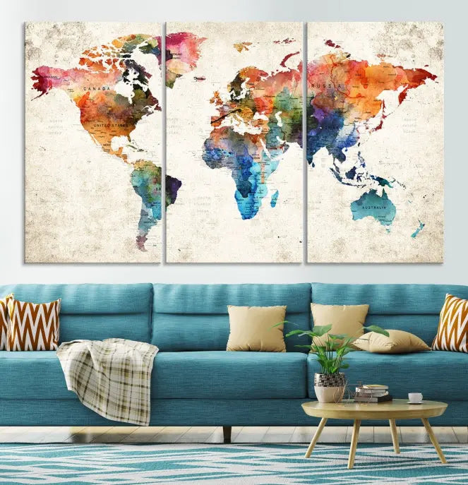 A Push Pin World Map Wall Art Canvas Print with a colorful abstract design and UV-protective coating is displayed on the wall.