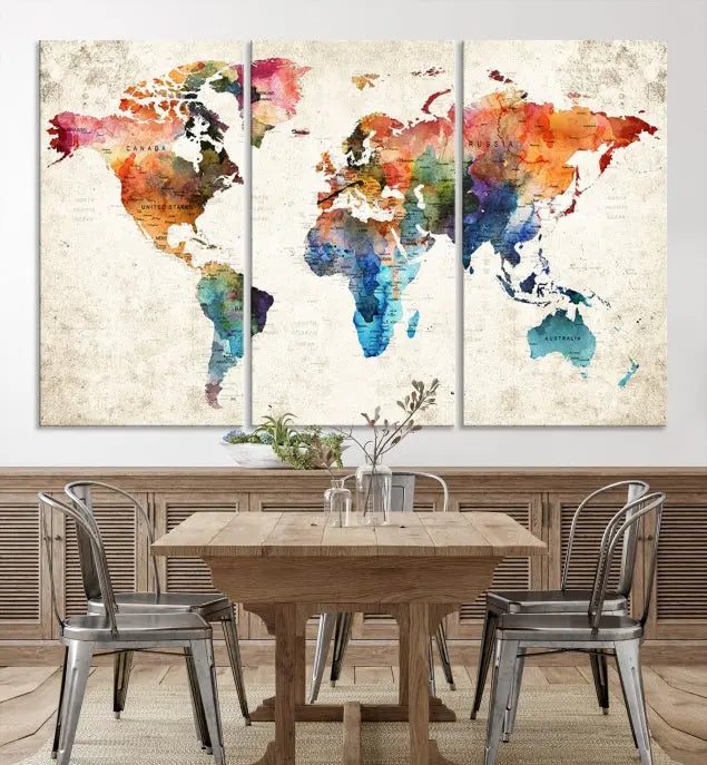 A Push Pin World Map Wall Art Canvas Print with a colorful abstract design and UV-protective coating is displayed on the wall.