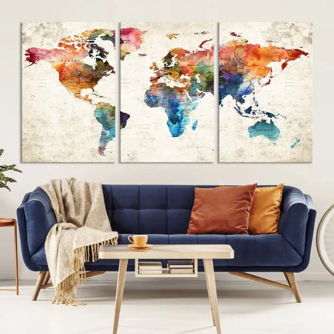 A Push Pin World Map Wall Art Canvas Print with a colorful abstract design and UV-protective coating is displayed on the wall.