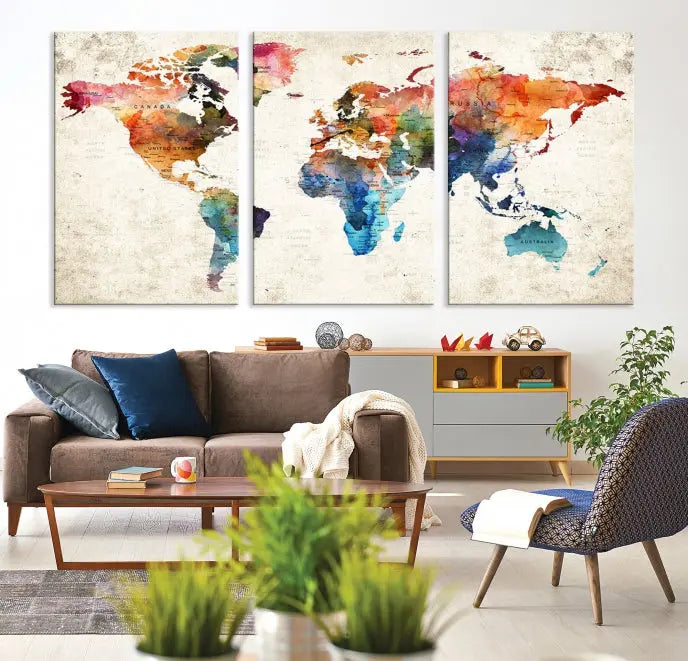 A Push Pin World Map Wall Art Canvas Print with a colorful abstract design and UV-protective coating is displayed on the wall.