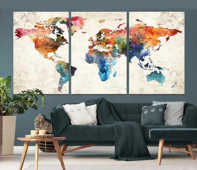 A Push Pin World Map Wall Art Canvas Print with a colorful abstract design and UV-protective coating is displayed on the wall.