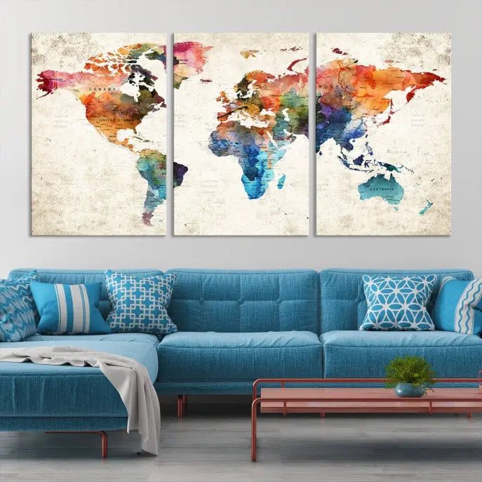 A Push Pin World Map Wall Art Canvas Print with a colorful abstract design and UV-protective coating is displayed on the wall.